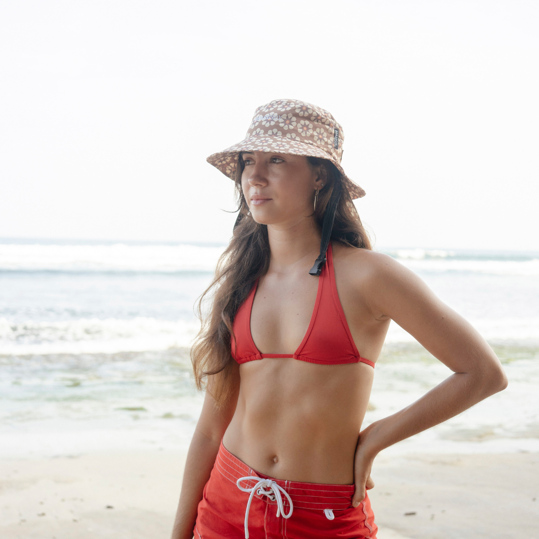 Coco Boardsox surf hat in cream with a brown daisy print