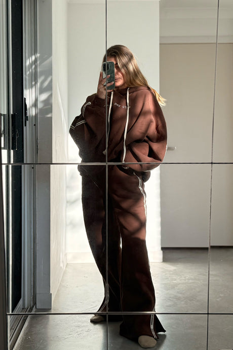 full length photo of cloud racer hoodie in chocolate colour by cracker day club worn with matching sweatpants 