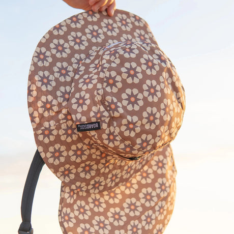 Kids Coco Boardsox surf hat in cream with a brown daisy print