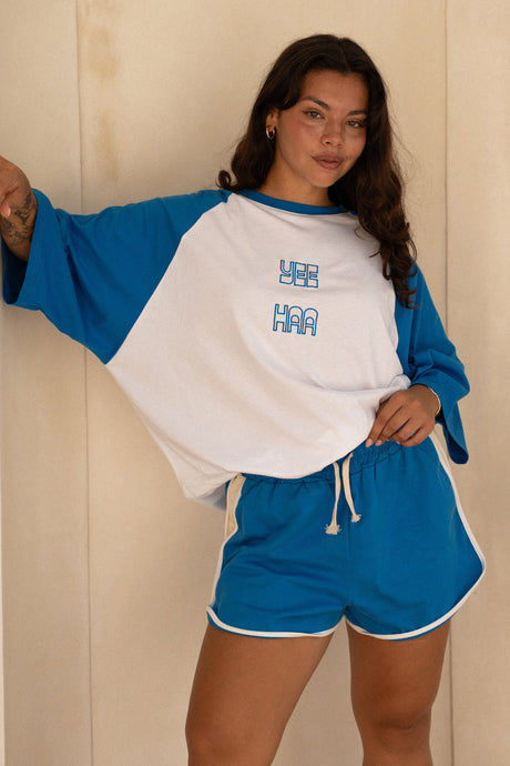 plus size girl wearing blue yee haa raglan tee shirt